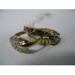 An 18ct Gold Three Stone Ring, illusion set, between textured shoulders; together with a 9ct gold