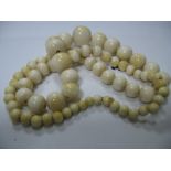 A Late XIX Century String of Graduated Ivory Beads, of plain globular form. 66cm.