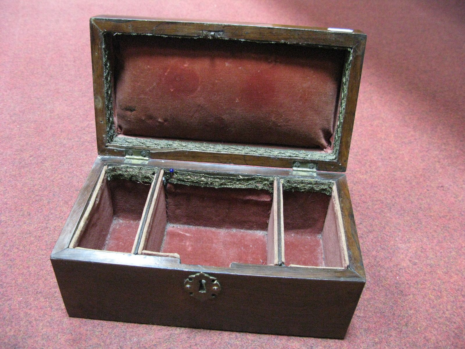 A XIX Century Mahogany Box, with brass escutcheon (lacking lock), plush lined, 28 cms wide.