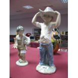 Nao Figurine, of a boy wearing a cowboy hat, together with a Nao figure group of a boy holding a