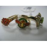 Three Modern 9ct Gold Dress Rings, each claw set. (Three)