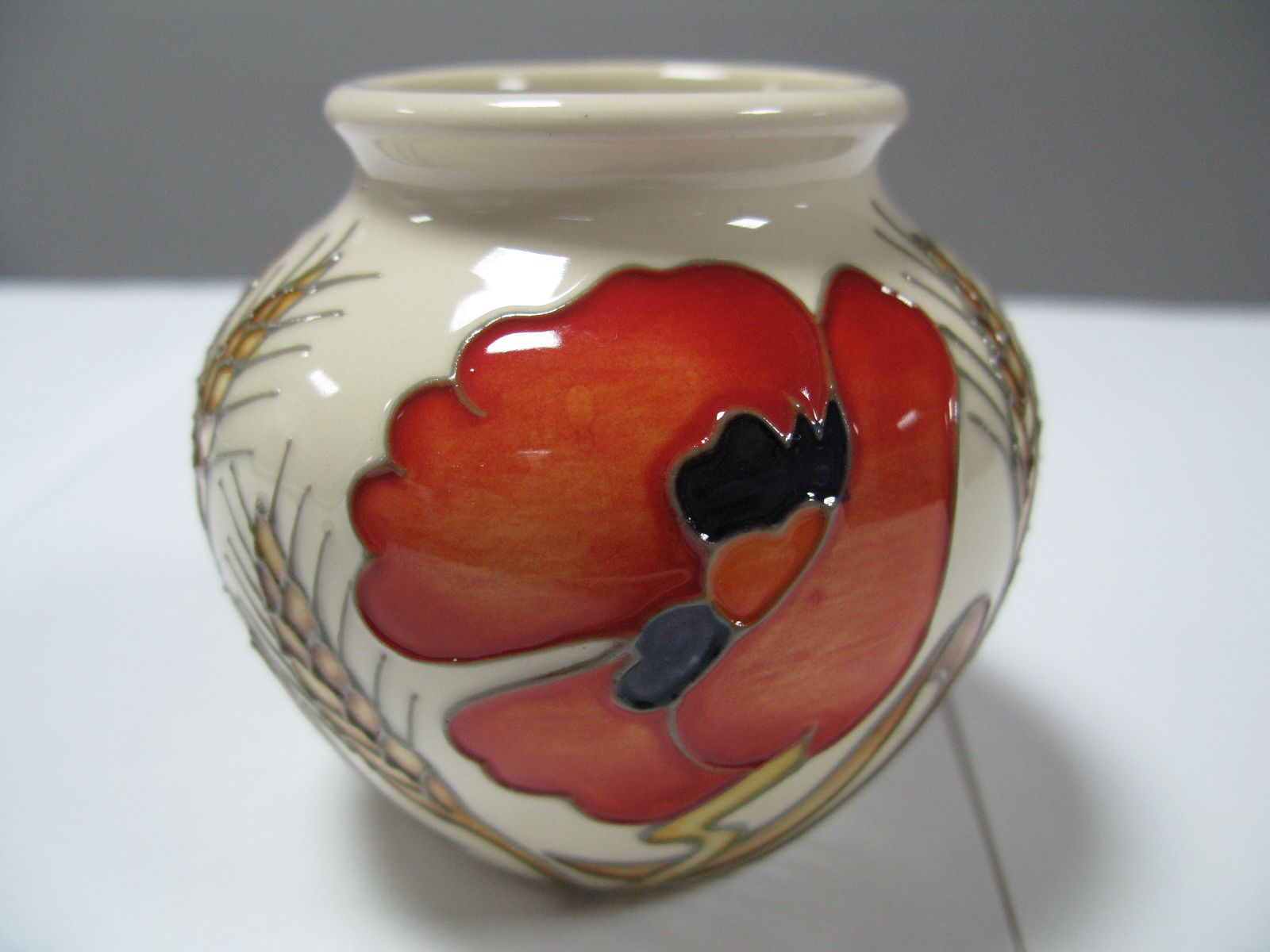 A Moorcroft Pottery Vase, decorated with the Harvest Poppy design by Emma Bossons, shape 55/3,