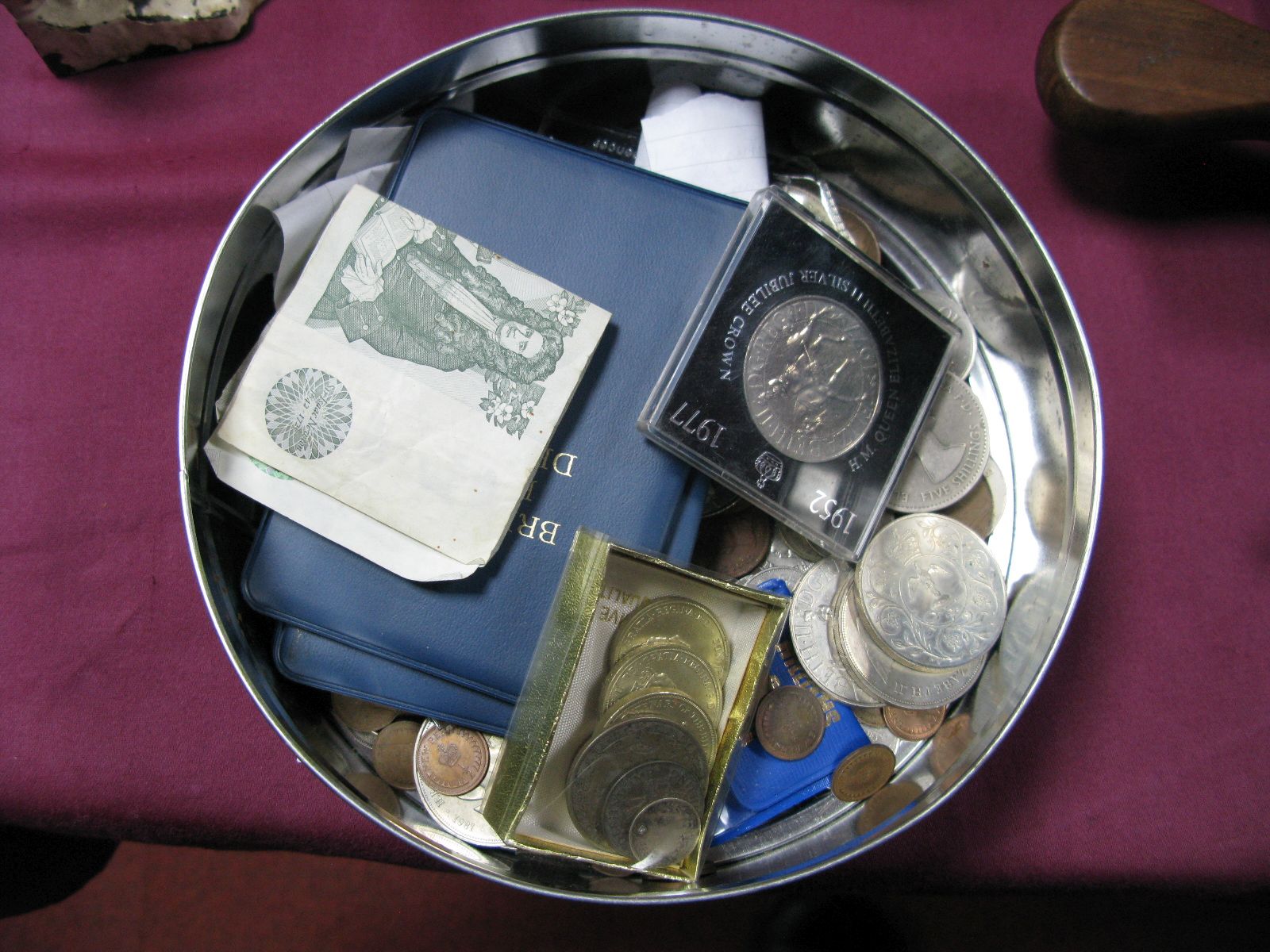 Four £2 Coins, four shillings of pre 1947 silver coinage, other coinage, two £1 banknotes:- One Tin