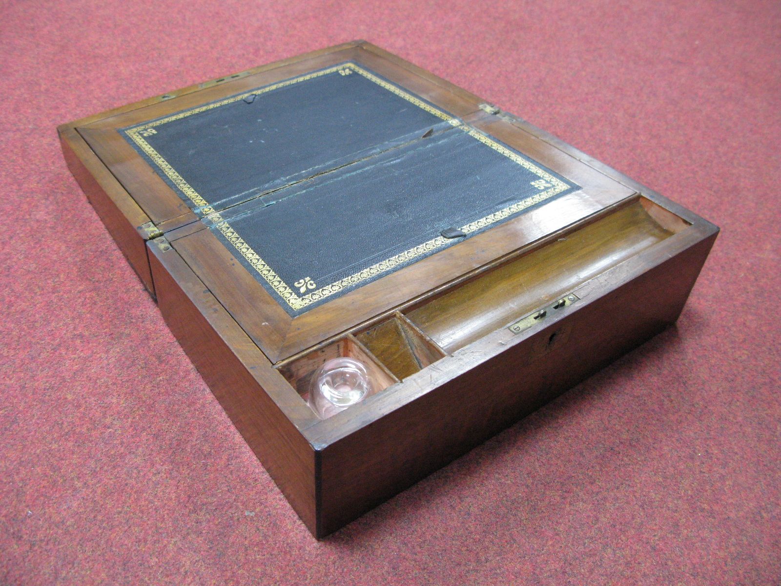 A Victorian Walnut Writing Slope, gilt tooled black leather scriver, blank brass plaque to lid.