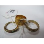 A Wide Patterned Band, together with a 9ct gold eternity style band, and another ring. (3)