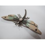 An Art Deco Style Dragonfly Brooch, oval cabochon set to the centre, between enamel and marcasite