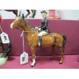 Beswick Pottery, brown horse with female rider, sporting black coat, 21cms high.