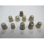 A Collection of Ten Assorted Thimbles, of differing designs, including hallmarked silver. (10)