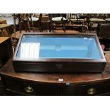 Mahogany Table Top Display Cabinet, having slope front and light blue baize interior.
