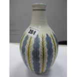 A Mid XX Century Poole Vase, of slender globular form, tapering neck, decorated with foliate