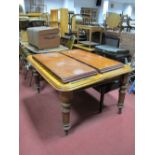 XIX Century Mahogany Wind Out Dining Table, with a moulded edge, on turned and reeded legs, with two