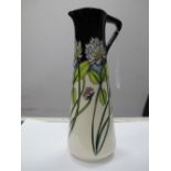 A Moorcroft Pottery Jug, decorated with the Trefoil design by Nicola Slaney, shape JU3, impressed