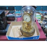 "BHA" Stamped Brass 400 Day Clock, with safety bridge and key, under glass dome.