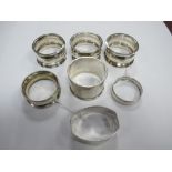 A Set of Three Hallmarked Silver Napkin Rings, together with four further napkin rings. (7)