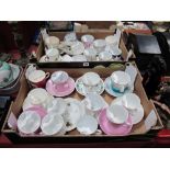 A Quantity of Victorian and Later Moustache Cups and Saucers, varying designs, including pink