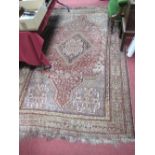XX Century Persian Style Rug, with geometric lozenge decoration, tassel ends, (worn and faded),