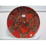 Poole Pottery Aztec Style Charger, with black linear abstract decoration on a red ground, makers
