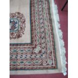 XX Century Wool Carpet, cream border and centre, circular motive, tassel ended, 404 x 311cms.