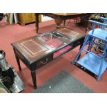 A Reproduction Mahogany Coffee Table, fitted with twin gilt tooled inserts, flanking central display