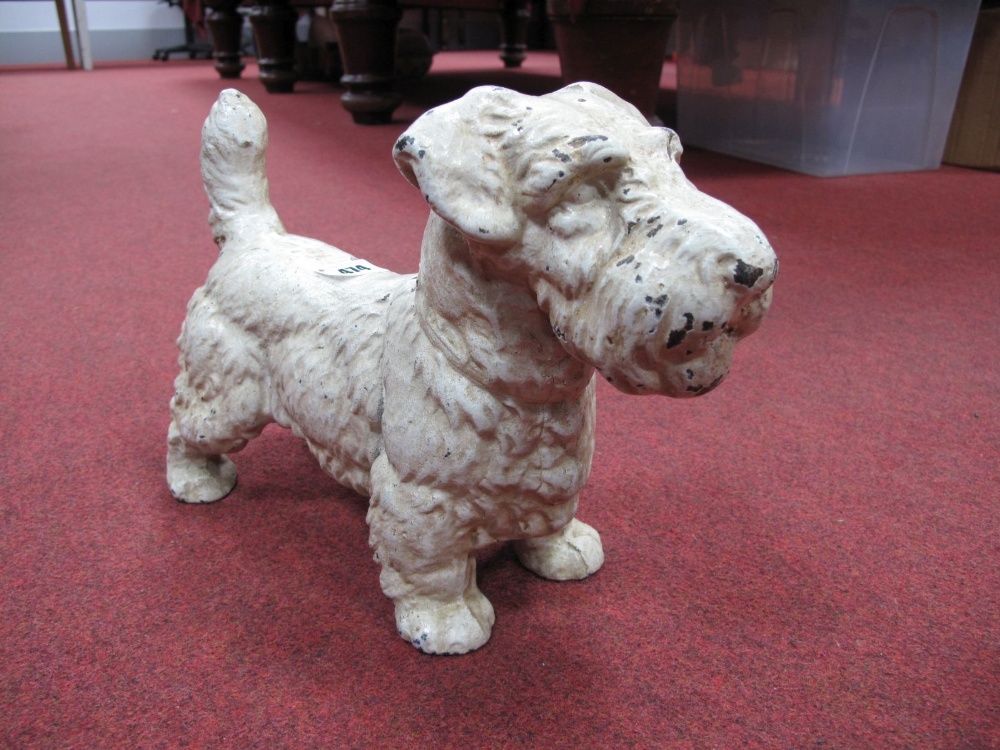 White Painted Cast Iron Door Stop, in the form of a terrier dog, 22.5cms tall.