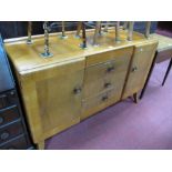 Beautility Mid XX Century Walnut Sideboard, having low back, three drawers, flanking cupboards on