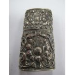 A Continental Lighter, allover detailed in relief with leaf scrolls, 6.2cms long.