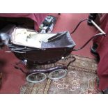 Early XX Century Pram, in maroon with white piping.