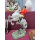 Beswick Pottery, dapple grey roaring horse, with male rider sporting red coat, impressed number 868,