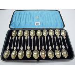 A Set of Eighteen Plated Teaspoons, each of Apostle style with twisted stem and gilt bowl,