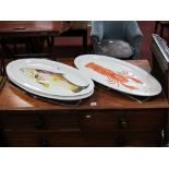 A Set of Three Italian Large Oval Fish Plates, raised decoration of a trout, lobster and shoal of