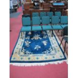 A Taiwan Sculpted Tasseled Wool Pile Rug, central floral motifs on a deep blue ground, all within