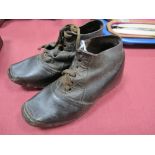 A Pair of Late XIX Century Stitched Leather Childs Clogs, nailed wooden soles, 14cms in length.