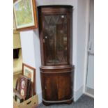 XX Century Mahogany Double Corner Cupboard, with glazed astragal door, over cupboard on bracket