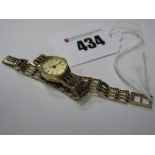 Accurist; A 9ct Gold Cased Ladies Wristwatch, to integral bracelet with 9ct gold clasp.