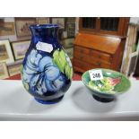 A Moorcroft Vase, of baluster form, decorated in the Hibiscus pattern on a deep blue ground