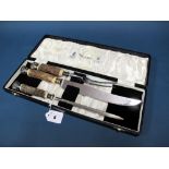 A Mappin & Webb Three Piece Carving Set, each with stag horn handle and scroll capped end, in