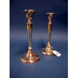 A Pair of Hallmarked Silver Candlesticks, (marks rubbed) each of plain tapering design, on
