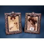 A Matched Pair of Hallmarked Silver Mounted Photograph Frames, SS, London 1982, 1983, each on blue