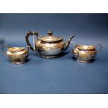 A Hallmarked Silver Three Piece Teaset, R&WS, Sheffield 1927, each of plain oval form, total