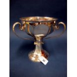 A Hallmarked Silver Three Handled Pedestal Cup, Charles Clement Pilling, London 1907, of panelled
