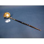A Georgian Toddy Ladle, the bowl with side spout and twisted handle, 39cms long.