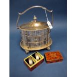 A Plated Mounted Cut Glass Biscuit Barrel, of oval form with hinged lid and shaped swing handle,