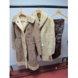 A Ladies Full Length Light Brown Sheepskin Coat, fitted Cossack style with trim to hem and front