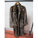 A Dark Brown Ankle Length Mink Coat, with collar, two large patch pockets and turn back cuffs,