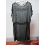 A 1920's Black Chiffon Flapper Dress, with cap sleeves and black beaded panels to each side of