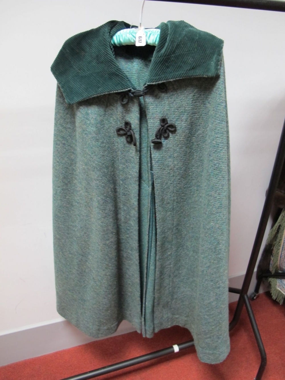 A Green Wool Tweed Elgee of London Cape, with contrasting green corduroy lined hood and frog