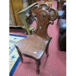 XIX Century Mahogany Hall Chair, with trefoil scroll back, shield shape seat on turned legs.