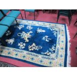 A Taiwan Sculpted Tasseled Wool Pile Rug, central floral motifs on a deep blue ground, all within