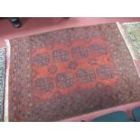 A Tassled Afghan Rug, with two rows of four guls within multiboarders, all on a red field, 175 x