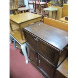 An Erol Dark Elm Bureau, fall front over cupboard doors, together with an erol elm square topped